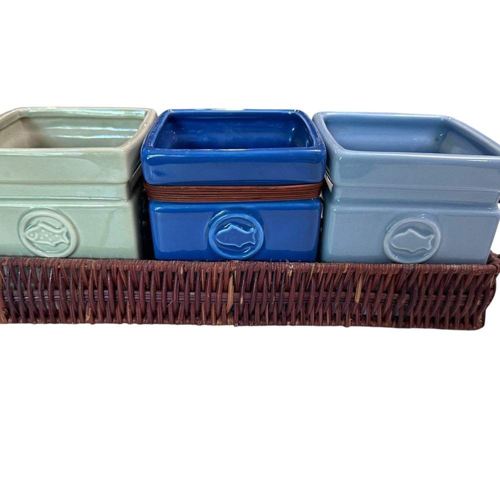 Department 56 square planters sitting on a wicker tray